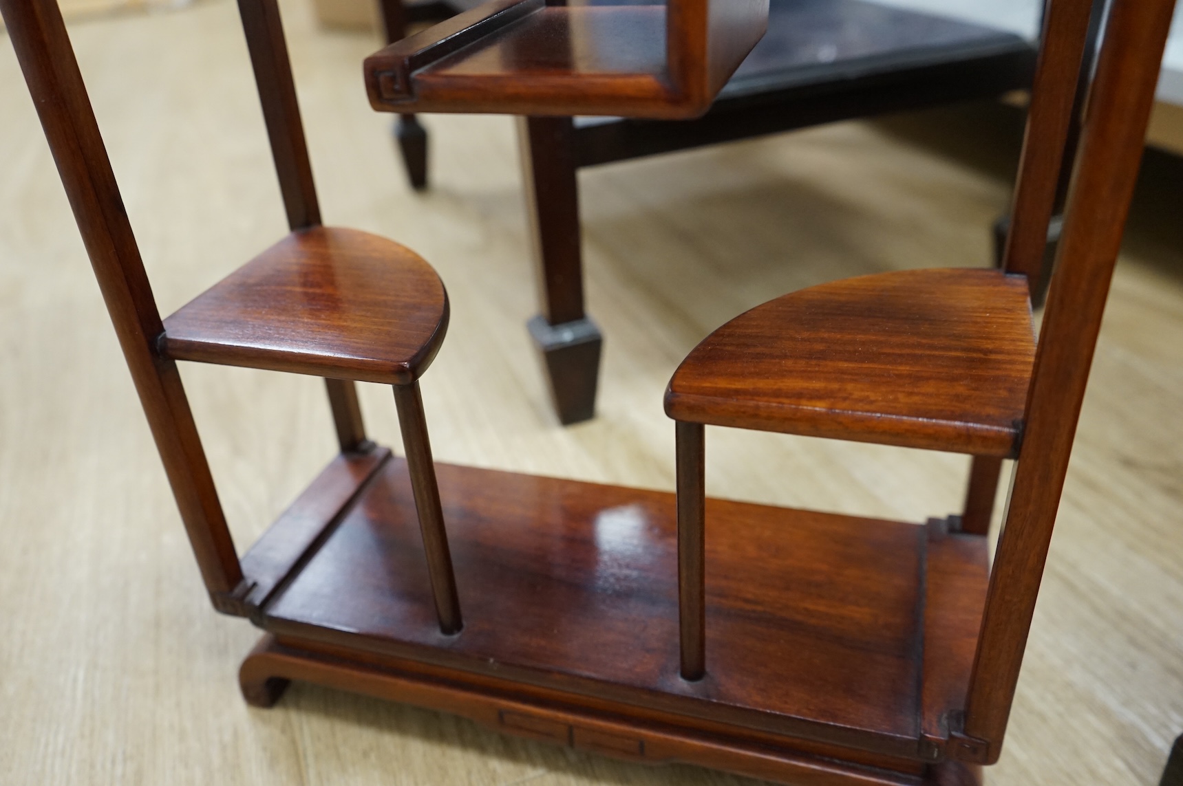 A Japanese lacquered table cabinet and shelves, largest 53.5 x 45cm